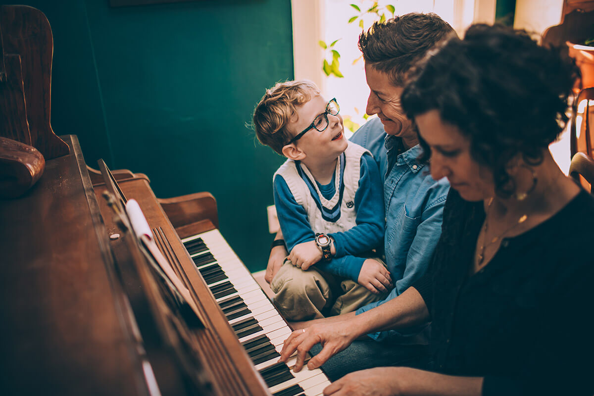 Parents with Child at Piano