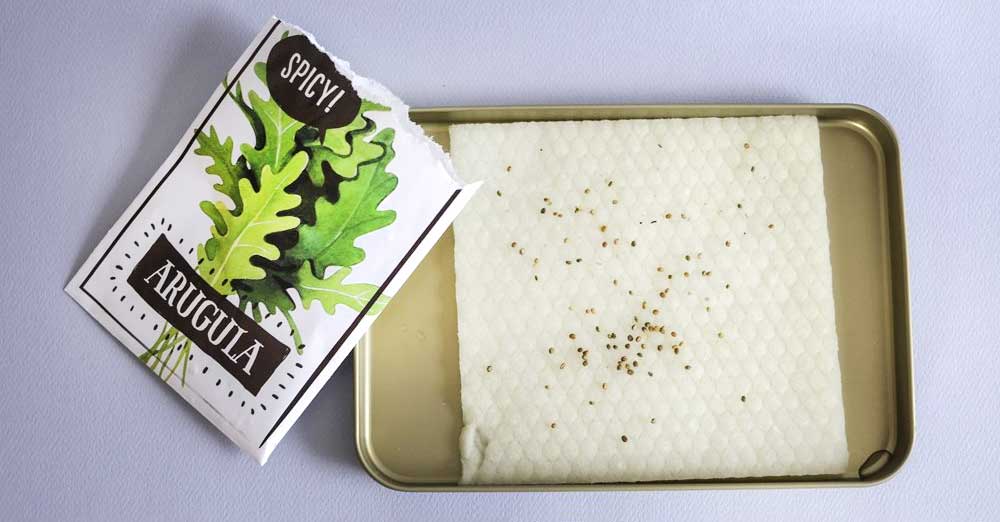a microgreens grow mat with a partially empty seed packet